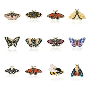 Size chart for 12 unique cartoon butterfly insect brooches with dimensions and weights