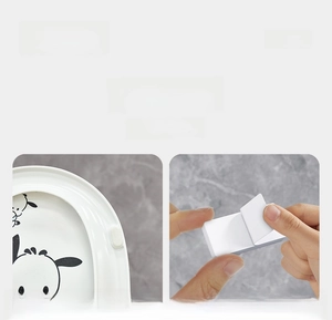 Detailed view of the toilet seat lifter installation with Sanrio cartoon design