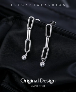 Macro view of silver S925 long chain earrings with sparkling D-color moissanite