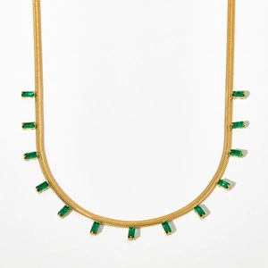 Gold-plated flat snake chain necklace with emerald green baguette zircon fringe pendants