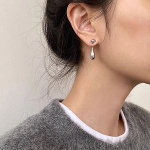 Elegant silver molten lava waterdrop earrings for women with minimalist high-polish finish