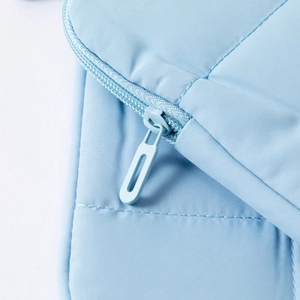 Light blue minimalist 14-inch laptop sleeve with anti-shock padded fabric and metal zipper