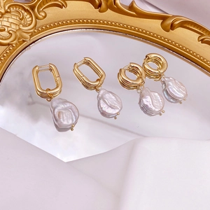 Baroque freshwater pearl earrings with irregular shapes and polished gold metal hoops