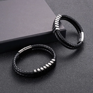 Detailed close-up of woven leather bracelets with silver and gunmetal magnetic clasps