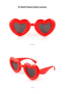 Detailed front and side view of red heart-shaped sunglasses with gray lenses