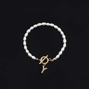 Elegant pearl bracelet with golden OT buckle and sparkling crystal letter Y pendant