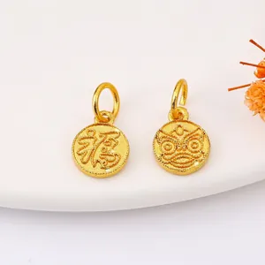 Traditional gold-plated Fu character and lion head round charms with sandblasted finish