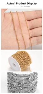 Detail of 18K gold and silver stainless steel bead satellite chains on spools for DIY jewelry