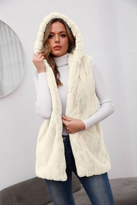 Detail of hooded faux fur vest in ivory showing soft texture and vertical plush pattern