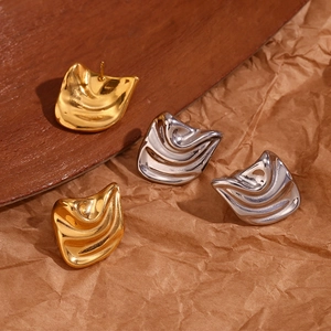 Detailed view of irregular wavy 18K gold and silver plated stainless steel stud earrings