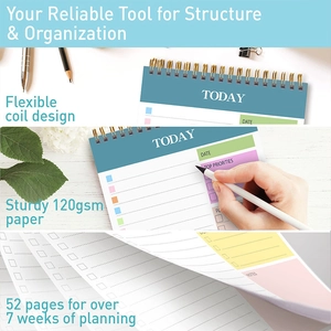 Detailed view of the gold spiral binding and smooth 120gsm paper of the daily planner