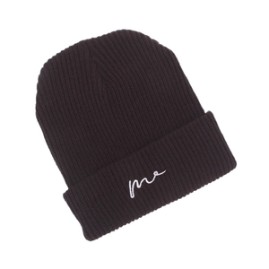 Detailed texture of dark coffee knitted beanie featuring white me letter embroidery