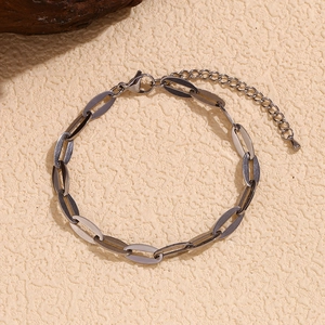 Detailed macro view of 14K gold-plated stainless steel lip chain with lobster clasp