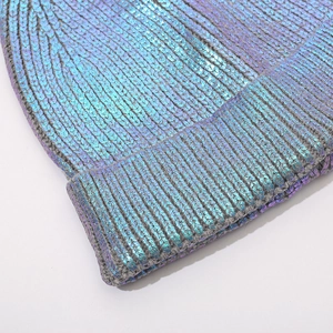 Metallic laser finish knitted beanie with pompom and iridescent rainbow shimmer effect