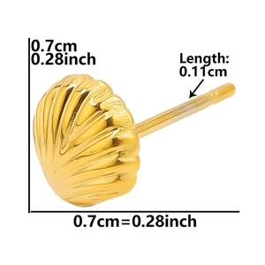 Macro view of gold seashell stud earring showing radial texture and detailed dimensions