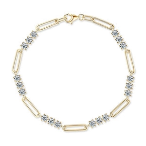 Detailed close-up of golden paperclip link bracelet featuring clear round zircon accents