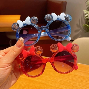 Kids cute cartoon sunglasses with round ears and bow in glitter blue and red