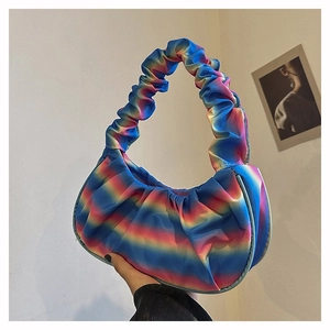 Close-up of rainbow gradient pleated shoulder bag with satin texture and elastic handle