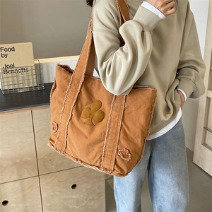 Vintage brown canvas tote bag with plum blossom patch and fringe trim detail
