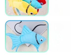 Detail showing plush sea fish headbands with shiny silver sequins and 3D cartoon eyes