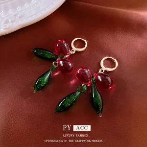 Vintage luxury gold hoop earrings with burgundy resin fruit and green leaf tassels