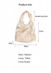 Detail view of bow print canvas bag with dimensions and polyester fabric texture