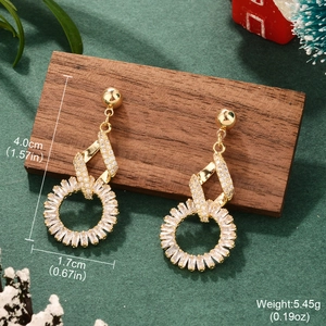 Detailed dimensions of gold bow heart earrings with cubic zirconia on green velvet