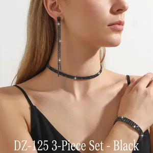 Detail of elegant black rhinestone jewelry set including choker, earrings and bracelet