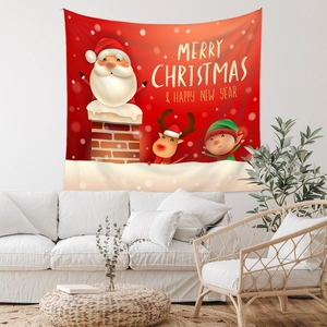 Cozy living room detail with festive Christmas tapestry hanging over a white sofa