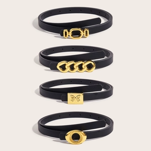 Four black minimalist leather belts for women with stylish gold buckles on white background