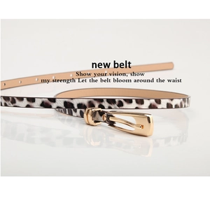 Close-up of slim leopard print belt with a polished golden alloy buckle for dresses