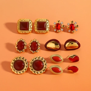 Retro stainless steel earrings set with red agate and zircon in golden finish