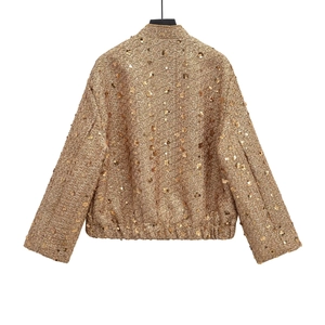 Back view of a gold sequined tweed jacket with a stand collar and elastic waist hem