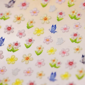 3D floral nail stickers with translucent resin butterflies and embossed flower patterns