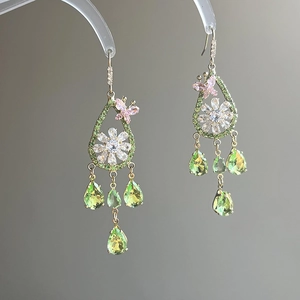 Elegant gold drop earrings with zircon butterflies, green flowers and teardrop crystals