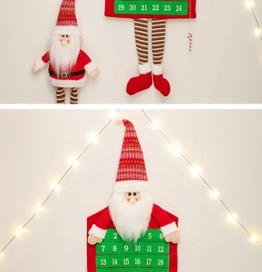 Close-up of Santa fabric advent calendar with numbered pockets and festive lighting