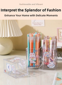 Close-up of clear acrylic desk organizer with cute rabbit stickers and colorful pens