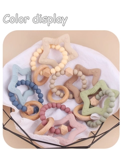 Detail showing multi-color silicone star teething beads and natural wood ring toy