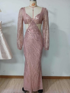 Detail of pink sequin evening dress featuring V-neck and waist cut-outs on a mannequin