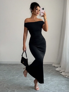 Detail of elegant black off-shoulder maxi dress with side ruching and slim fit design