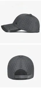 Detail view of winter grey quilted baseball cap with Sport Fashion tag and adjustable buckle