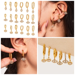 Detailed grid view of 18k gold plated evil eye and Hamsa hand earrings on models