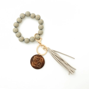 Detail of leopard print bead keychain with engraved MAMA wood disc and grey tassel