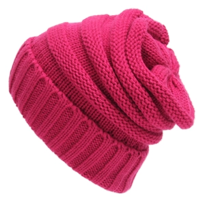 Close-up of rose red chunky knit beanie texture showing detailed acrylic yarn stitching