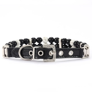 Close-up of black pearl pet collar with rhinestone buckle and adjustable PU leather strap
