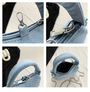 Detail view of blue denim handbag with silver chain strap and zipper close-up shots