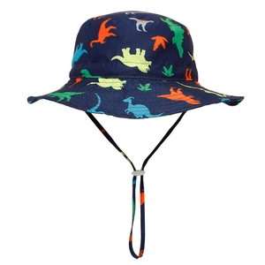 Detailed view of kids sun hat featuring colorful dinosaur print and adjustable chin strap