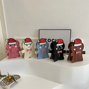 Gingerbread man crossbody bags in five colors with festive gold chain straps