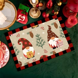 Close-up of Christmas gnome placemat featuring red buffalo plaid borders and pine cones
