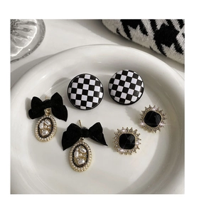Detailed set of 3 vintage earrings with black checkered studs and pearl bow drops